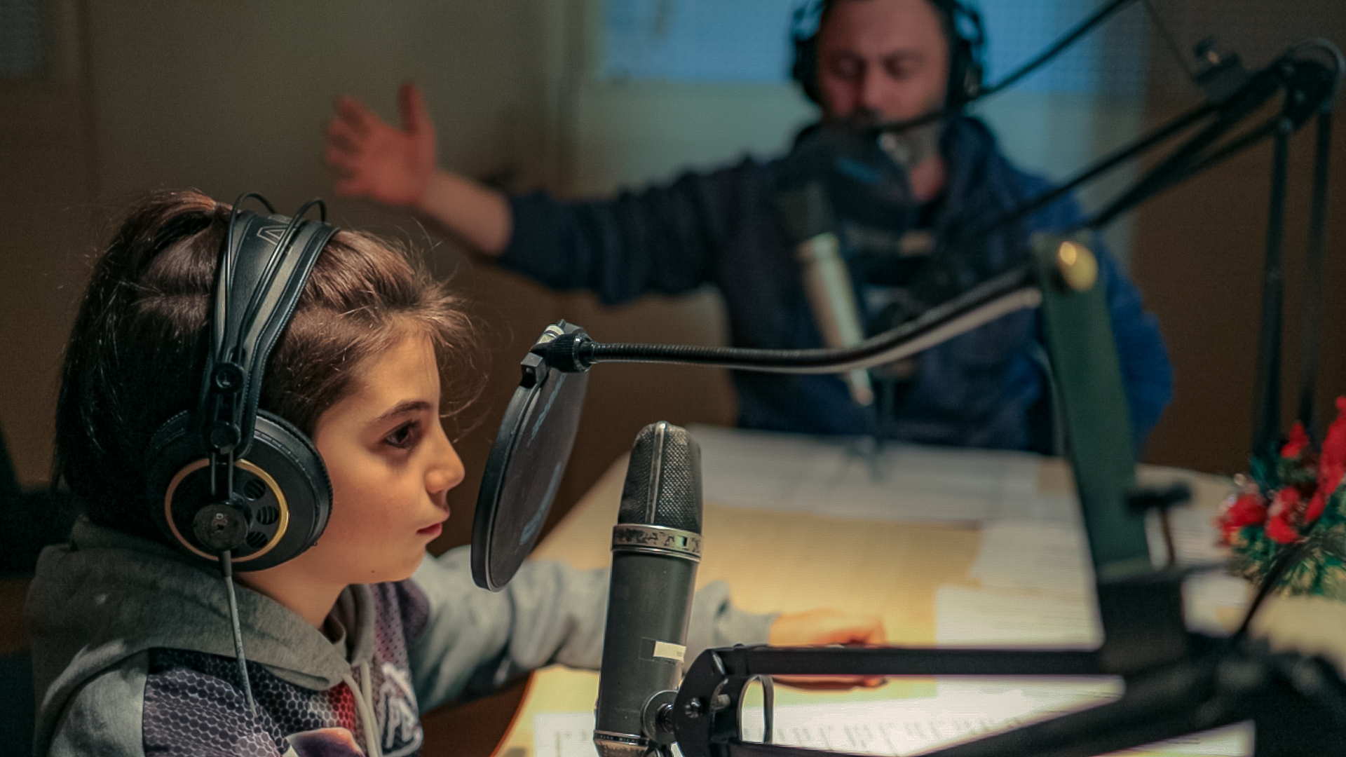 A child at the microphone during the recording